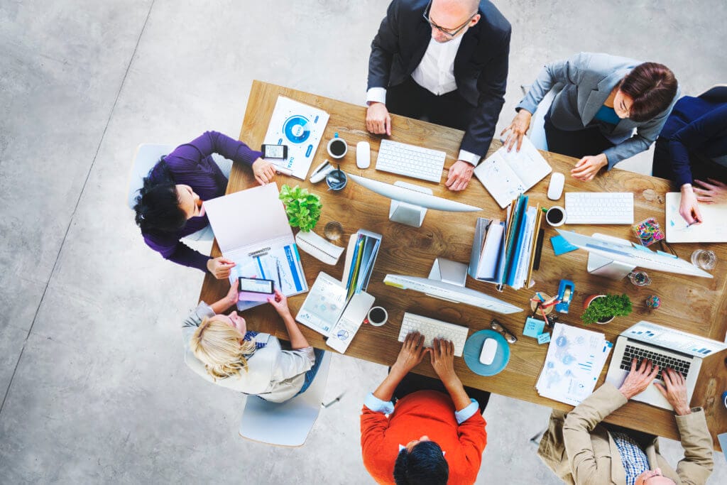 Team members collaborating in office